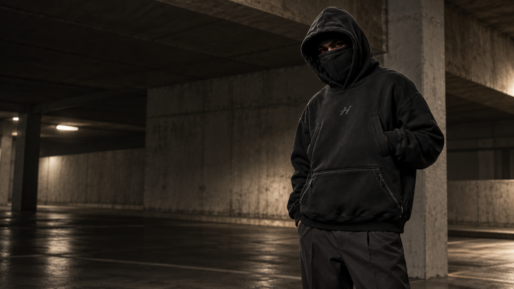 HYDEN campaign: the Washed Black Stealth Hoodie in a concrete city setting